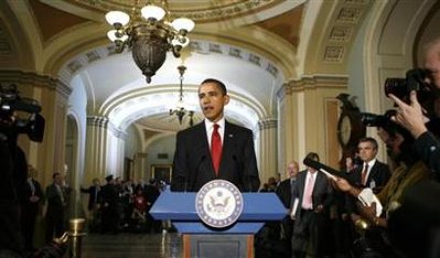 President Barack Obama speaks to reporters during his visit to the Capitol in Washington January 27, 2009.