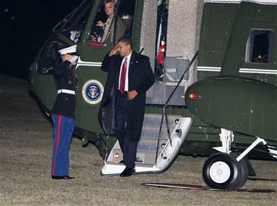 President Barack Obama arrives on the South Lawn of the White House in Washington, Thursday, Feb. 5, 2009. (AP Photo/Gerald Herbert)