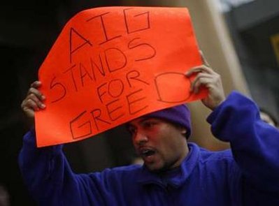 A protestor takes part in a rally in front of an American International Group (AIG) office calling on Congress to take action on employee free choice, health care, and banking reform in Washington, March 19, 2009. REUTERS/Jim Young 