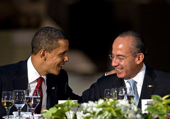 President Obama talks with Mexican President Felipe Calderón during a banquet at the Anthropology Museum in Mexico City. April 16, 2009 (Ronaldo Schemidt / AFP/Getty Images)