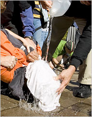 Protestors simulate waterboarding at a demonstration against the act. Manuel Balce Ceneta/Associated Press