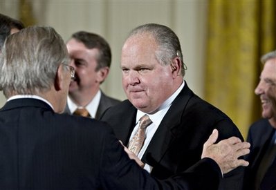 FILE - In this Jan. 13, 2009 file photo, conservative talk radio host Rush Limbaugh talks with former Defense Secretary Donald H. Rumsfeld in the East Room of the White House in Washington. Dick Cheney made clear he'd rather follow firebrand broadcaster Rush Limbaugh than former Joint Chiefs chairman Colin Powell into political battle over the future of the Republican Party. (AP Photo/J. Scott Applewhite, FILE)