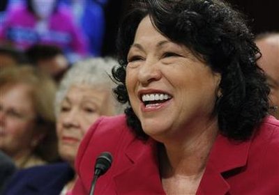 U.S. Supreme Court nominee Judge Sonia Sotomayor smiles while answering questions during her fourth and final day of testimony at her U.S. Senate Judiciary Committee confirmation hearings as her mother Celina Sotomayor (L) listens on Capitol Hill in Washington July 16, 2009.   REUTERS/Jason Reed