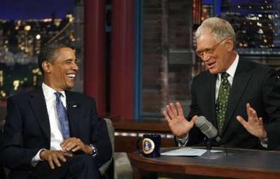 U.S. President Barack Obama laughs during the taping on his guest appearance on the "Late Show with David Letterman" show in New York, September 21, 2009. REUTERS/Kevin Lamarque